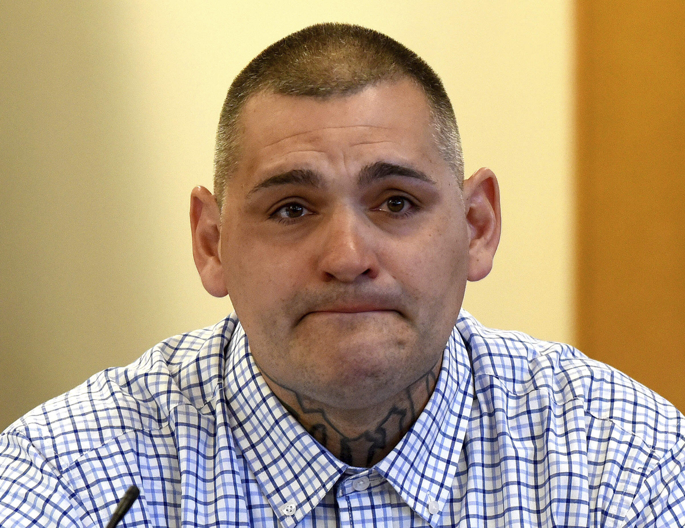 Michael Gilpatrick, a former youth detention center resident, fights back tears as testifies during a civil trial seeking to hold the state accountable for alleged abuse at the Sununu Youth Services Center, formerly called the Youth Development Center, April 17, 2024, at Rockingham County Superior Court in Brentwood, N.H. (David Lane/Union Leader via AP)