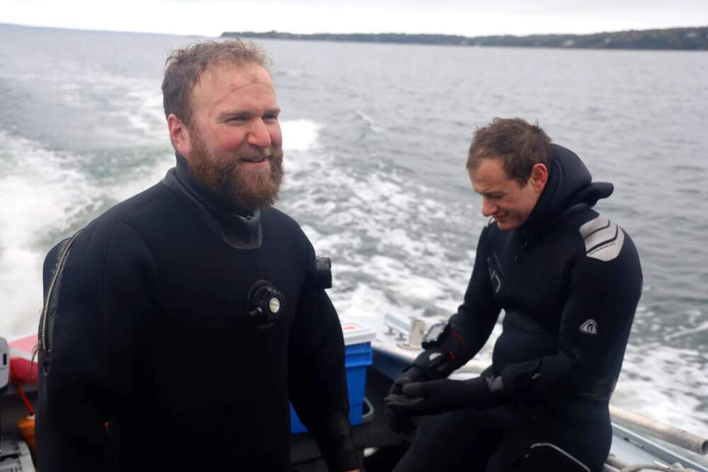 Noah Oppenheim, left, and Zach Talmadge, right, debrief after their dive. (Esta Pratt-Kielley/Maine Public)