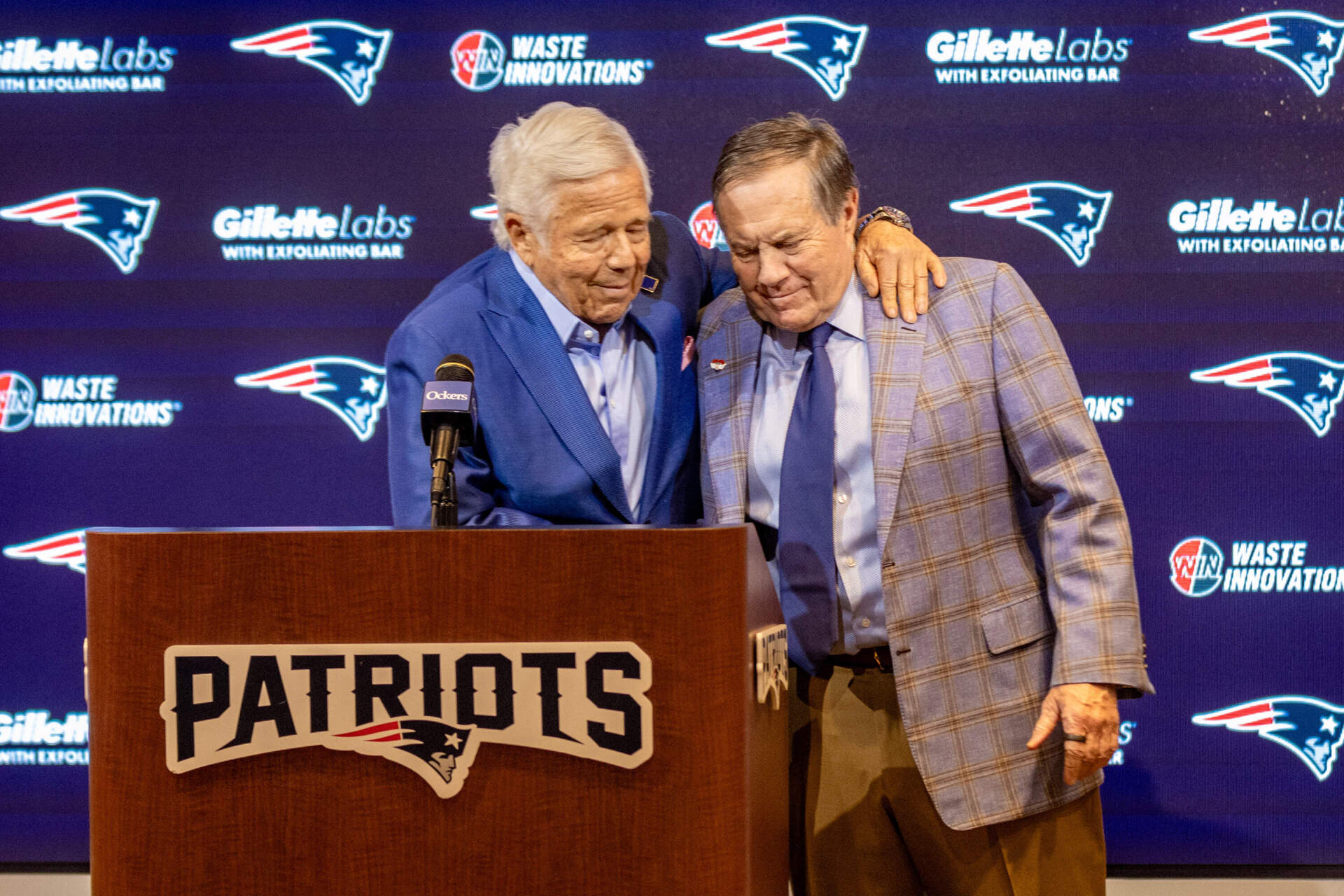 Patriots owner Robert Kraft hugs former head coach Bill Belichick at the end of a press conference announcing Belichick's departure from the team. (Jesse Costa/WBUR)