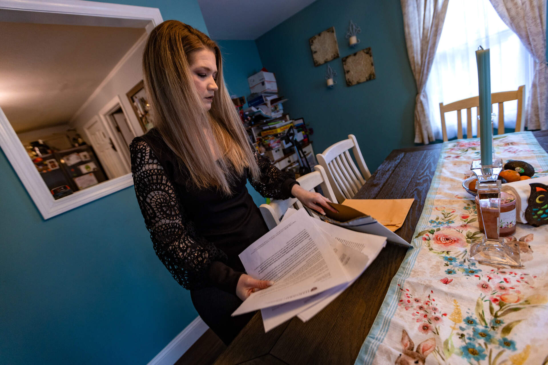 Amber Haggstrom files through all of the legal documents related to the Harvard morgue scandal.