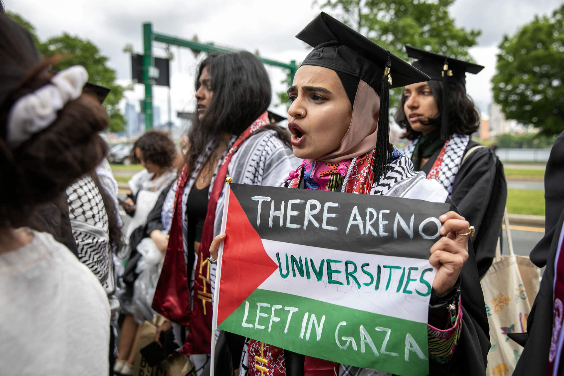 Graduates protesting the war in Gaza walk out of MIT's commencement ceremony.