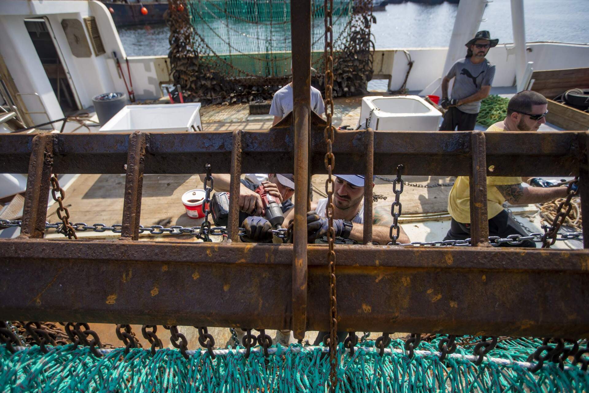 Scallop fisherman in New Bedford prepare their nets before heading out to sea. (Jesse Costa/WBUR)
