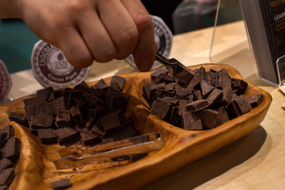 People sampling Taza Chocolate. (Hadley Green/WBUR)