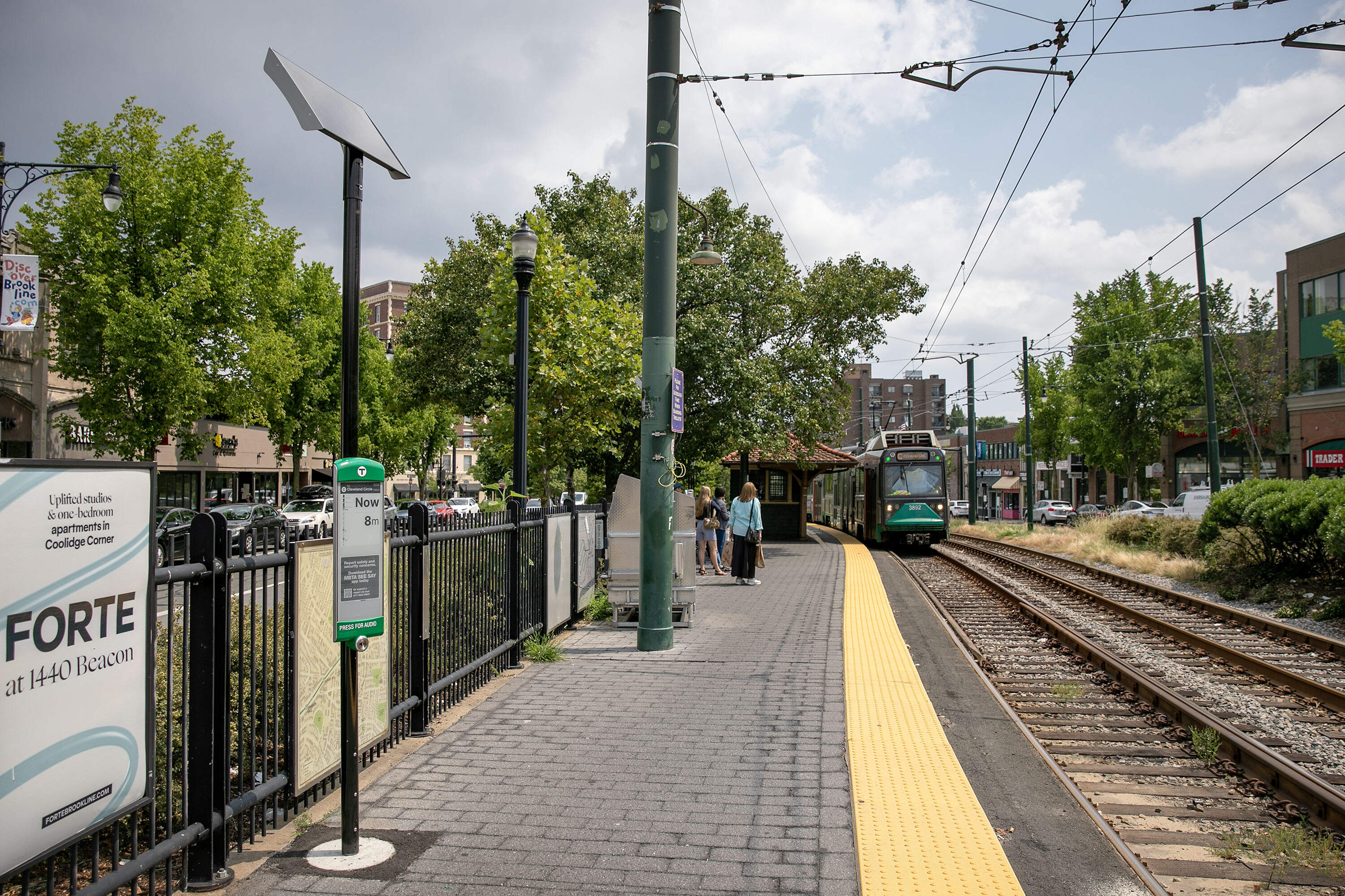 An solar powered MBTA real time arrivals display at Coolidge Corner shows a train arriving now. (Robin Lubbock/WBUR)