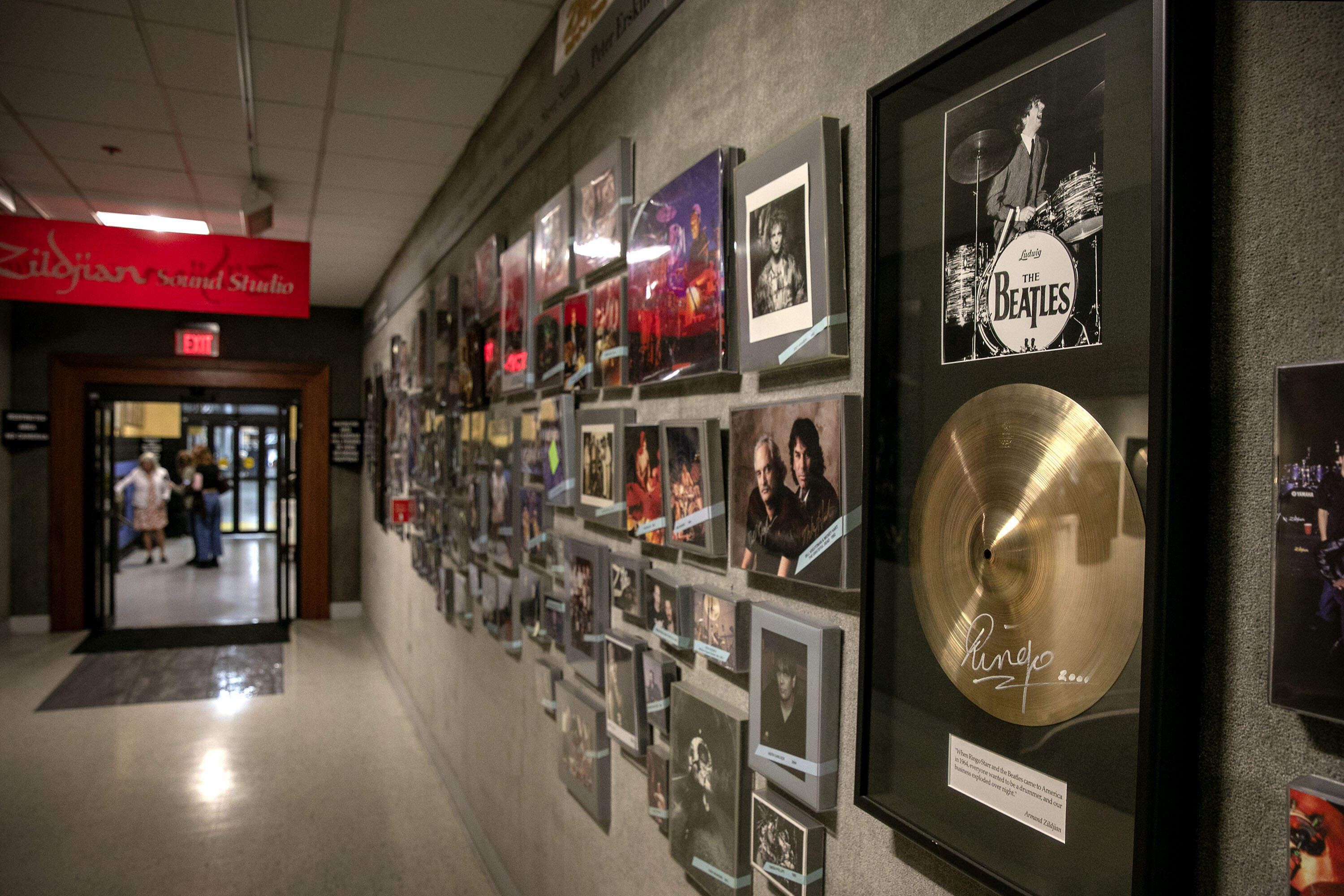 A Zildjian cymbal signed by Ringo Starr hangs on a wall of famous drummers at the Zildjian cymbal factory in Norwell, Mass. (Robin Lubbock/WBUR)