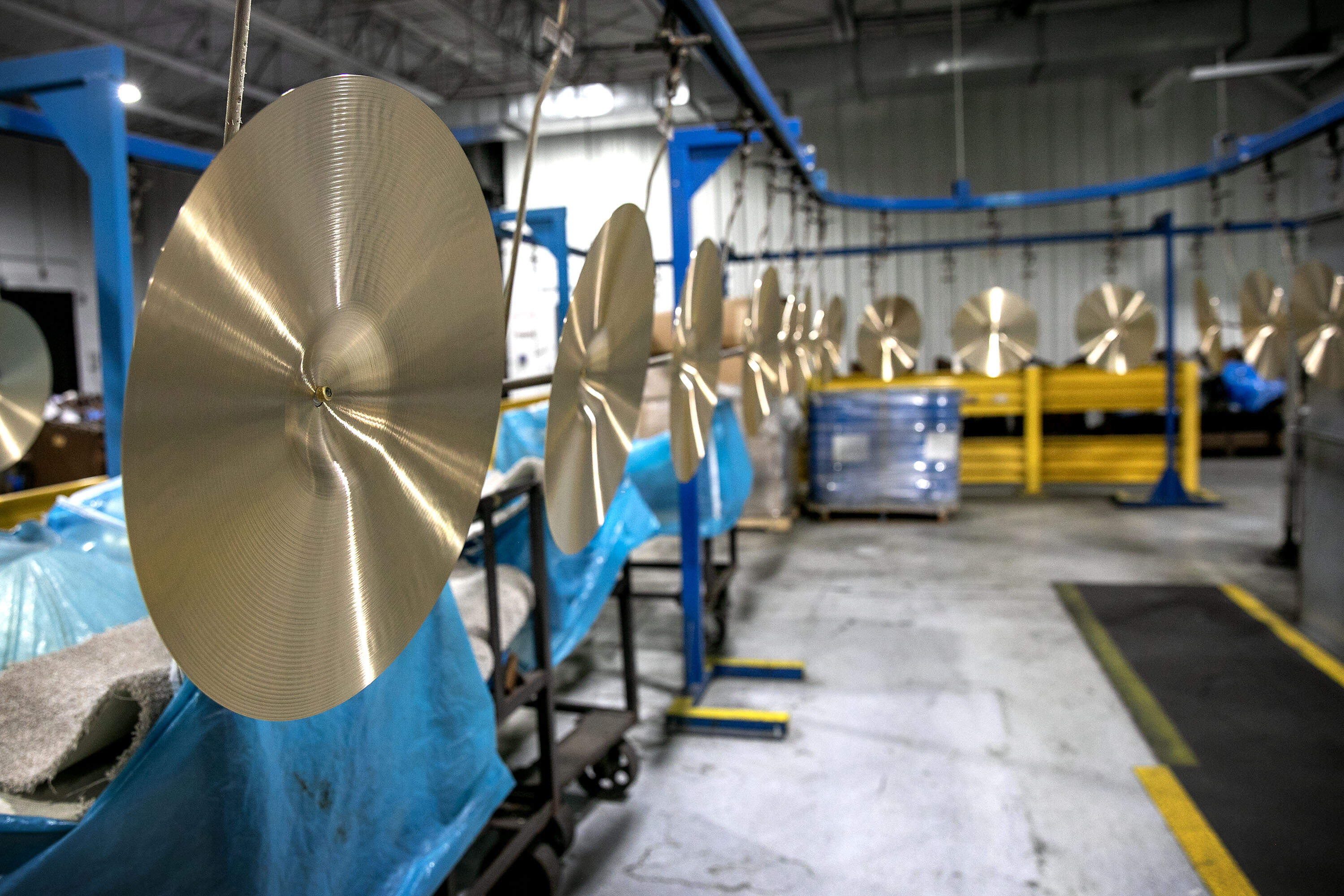 After coating, cymbals hang out to dry. (Robin Lubbock/WBUR)