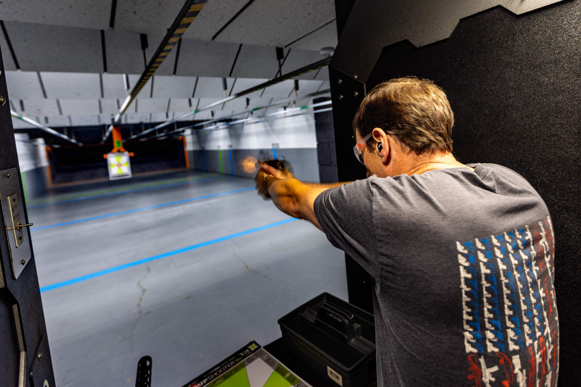 Toby Leary shoots a FN509 tactical pistol during a demonstration at the firing range at Cape Gun Works of guns that will be banned once the gun reform law goes into effect October 23.