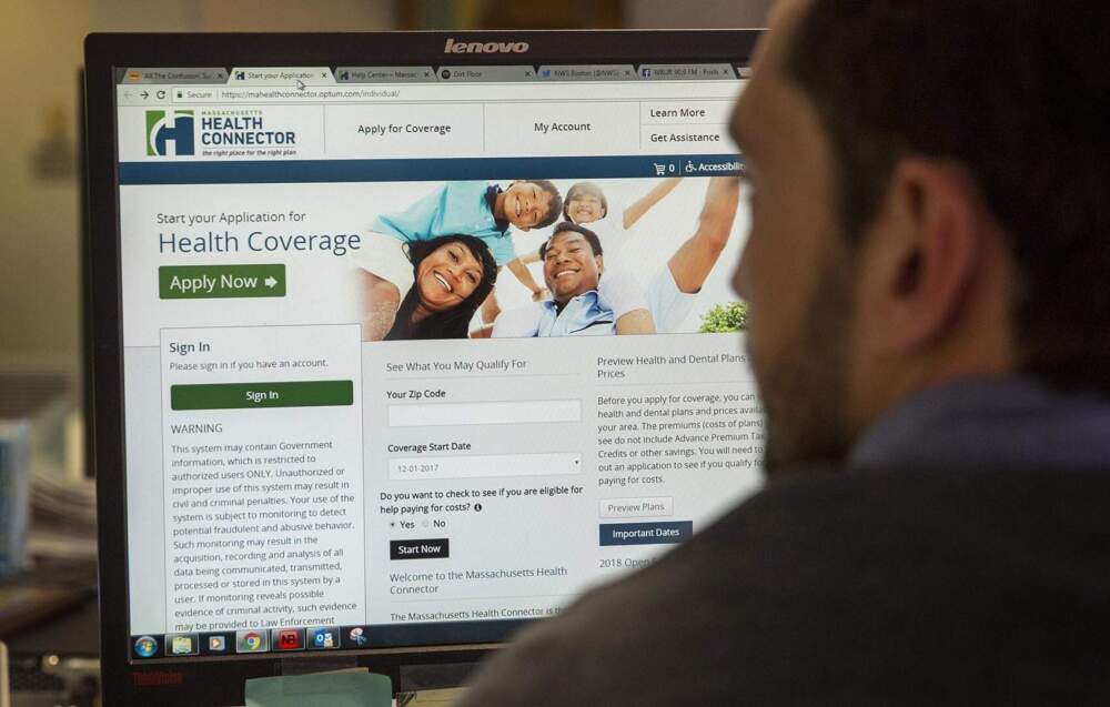 A man logs onto the Health Connector website, where Massachusetts residents can apply for health insurance. (Robin Lubbock/WBUR)