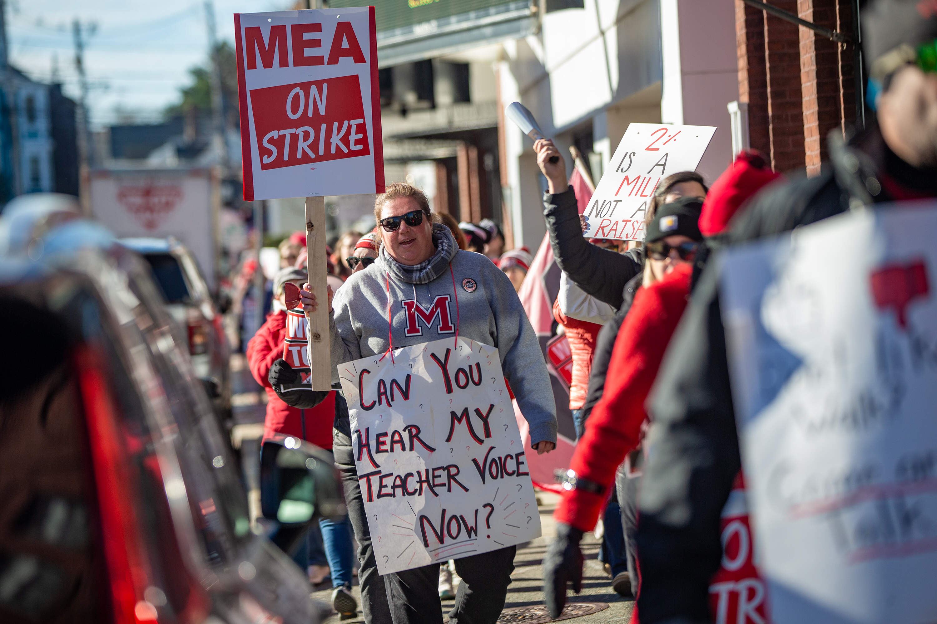 Teachers walk through Marblehead Center during a march on the fourth day of their strike.