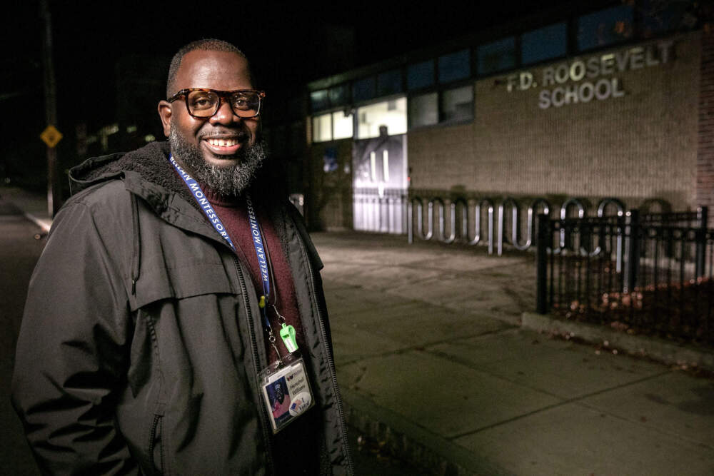 Voter Herschell Williams stands outside the school in Hyde Park where he waited for more that two hours to vote on Election Day. (Robin Lubbock/WBUR)