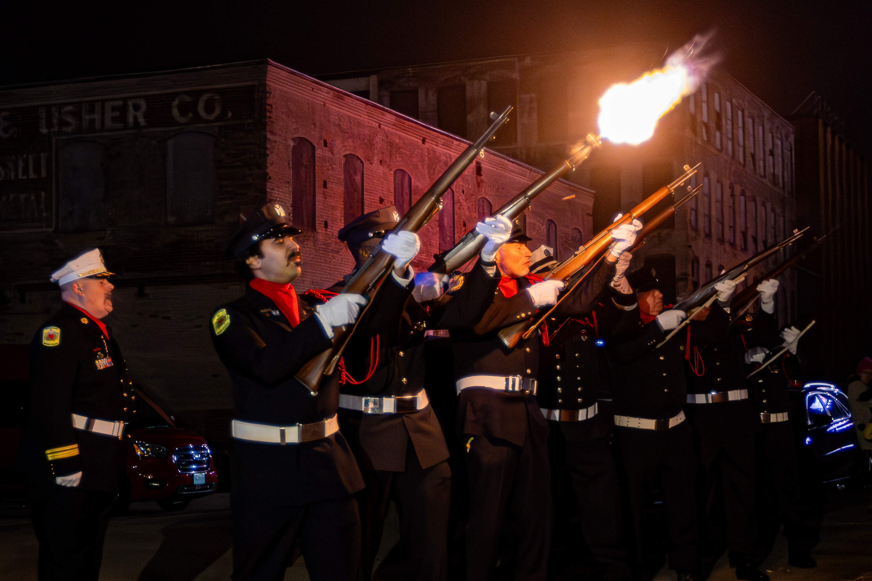 A 21-gun salute was performed during a ceremony to mark the 25th anniversary of the deadly fire. (Jesse Costa/WBUR)