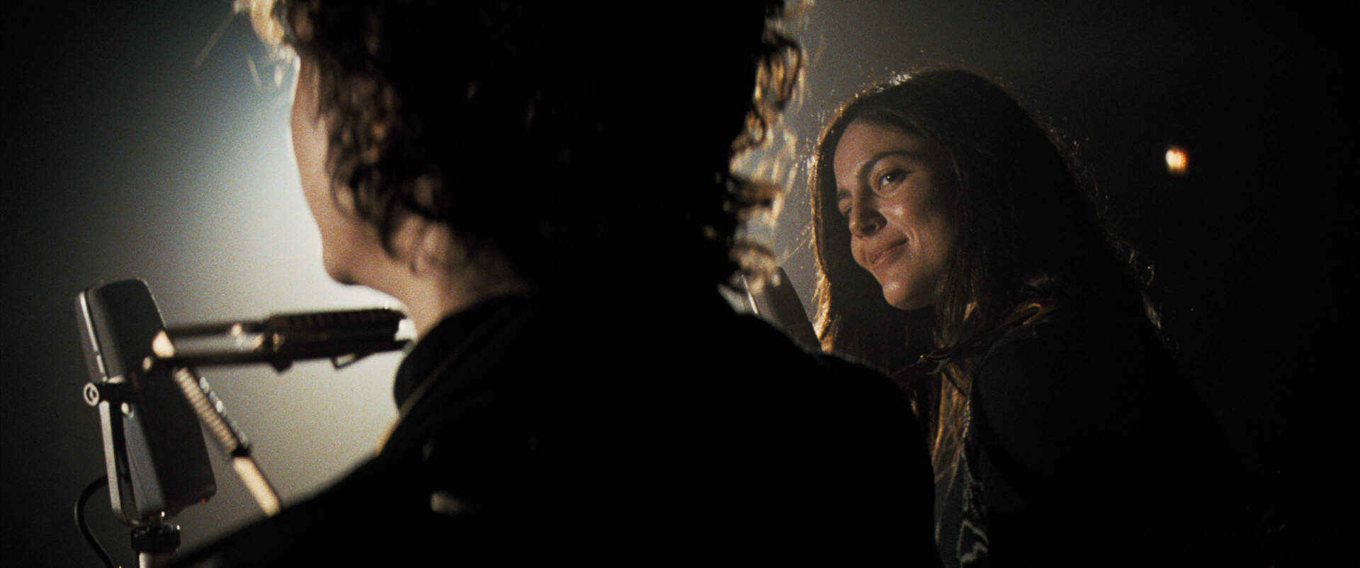 Timothée Chalamet and Monica Barbaro in "A Complete Unknown." (Courtesy Searchlight Pictures)