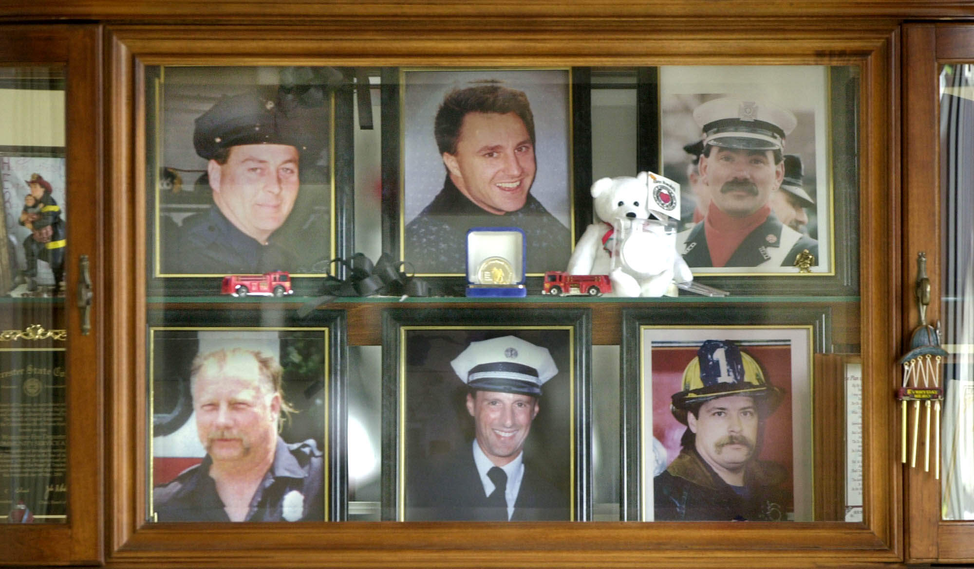 A display case in the lobby of the Worcester Fire Department Grove Street station in 2001 memorializes the six firefighters who were killed in December 1999 in Worcester. (Charles Krupa/AP)