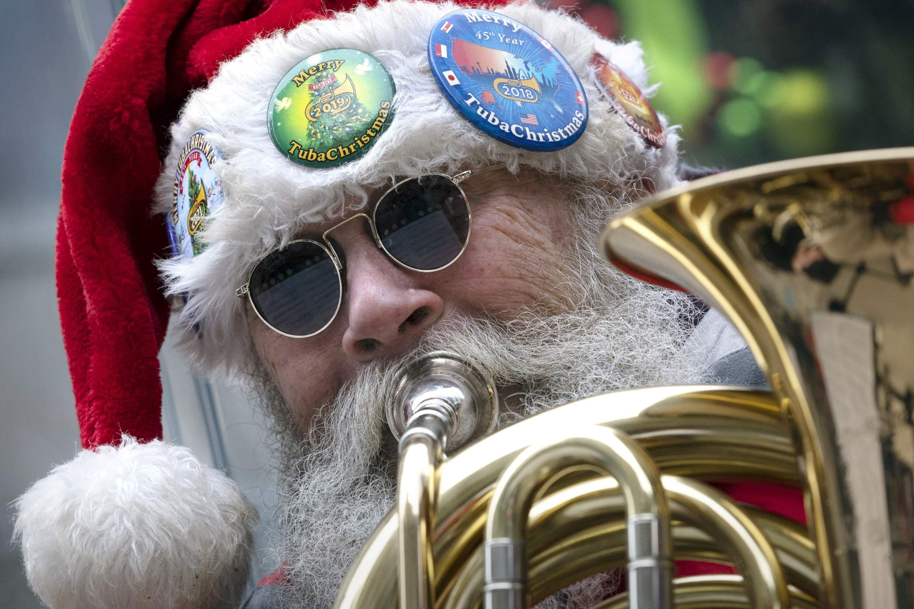 Brad Barr plays Christmas music with dozens of other tuba musicians. (Michael Dwyer/AP)