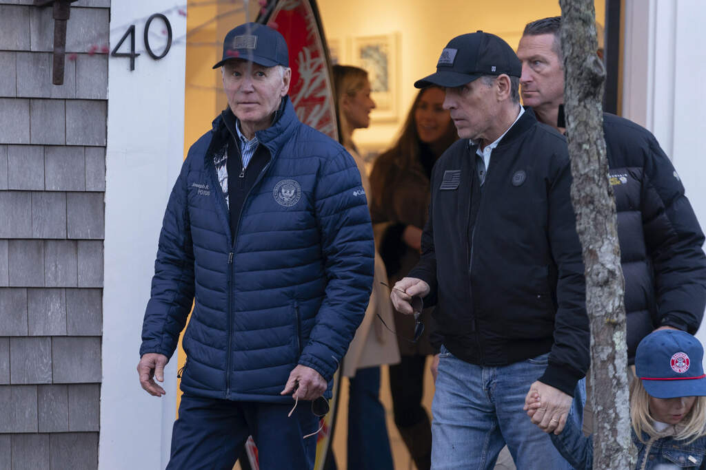 President Joe Biden and his son Hunter Biden walk in downtown Nantucket Mass., Friday, Nov. 29, 2024. (Jose Luis Magana/AP)