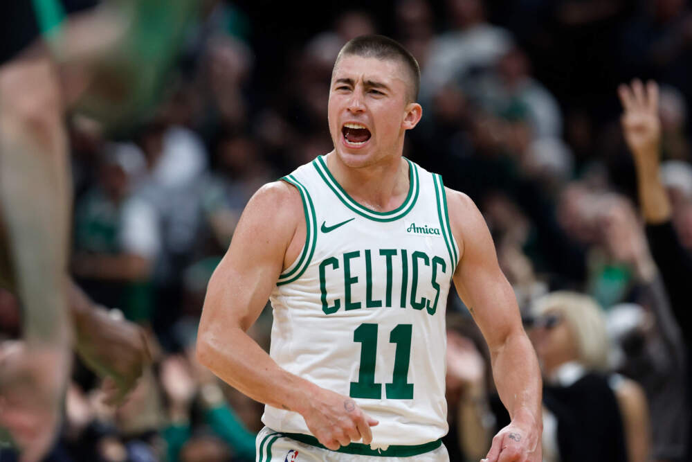 Boston Celtics' Payton Pritchard reacts after making a three-pointer during the second half of an NBA basketball game against the Milwaukee Bucks, Monday in Boston. (Michael Dwyer/AP)