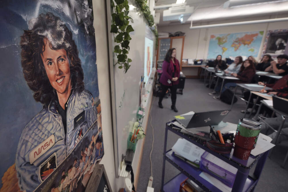 With a poster of NASA's first teacher in space Christa McAuliffe displayed on the wall, teacher Kimberly Bleier instructs her students in one of classrooms where McAuliffe taught at Concord High School, Monday, Dec. 16, 2024, in Concord, N.H. (Charles Krupa/AP)