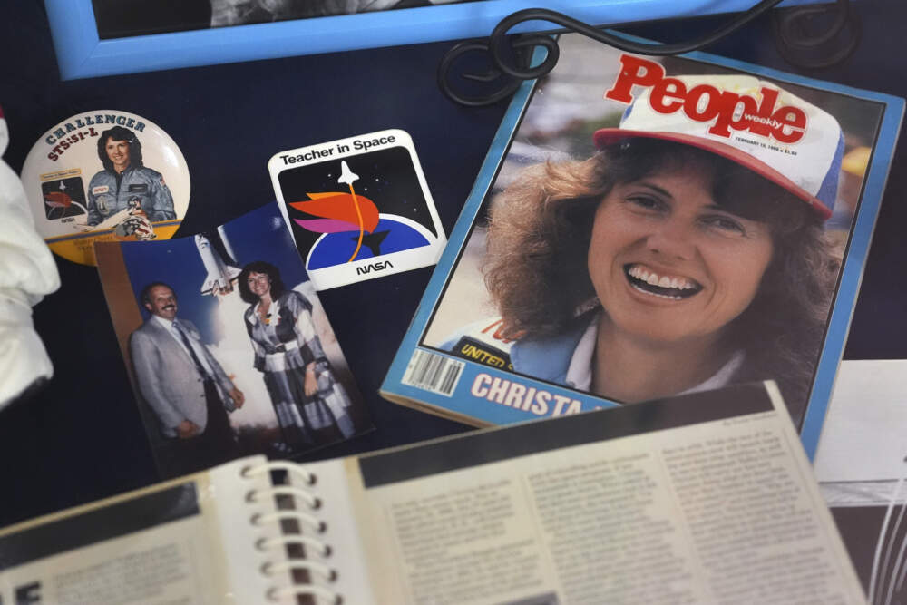 A selection of memorabilia featuring Christa McAuliffe, NASA's first teacher in space, is displayed at the McAuliffe-Shepard Discovery Center, Monday, Dec. 16, 2024, in Concord, N.H. (Charles Krupa/AP)