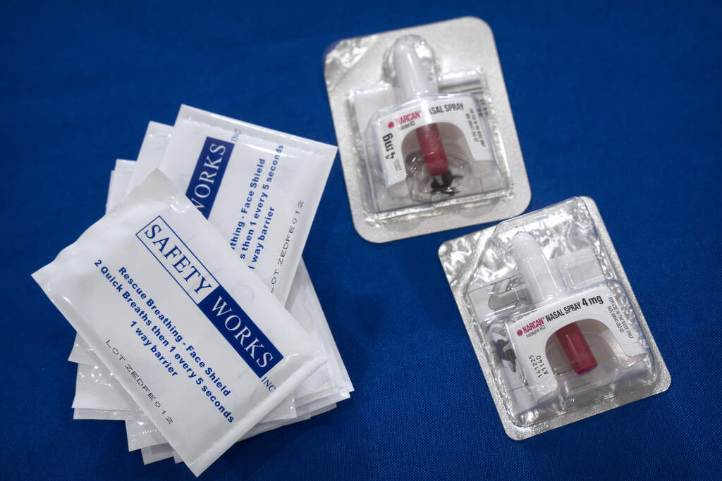 Containers of Narcan, a brand name version of the opioid overdose-reversal drug naloxone, sits on a table following a demonstration at the Health and Human Services Humphrey Building on Friday, Sept. 8, 2023, in Washington. (AP Photo/Mark Schiefelbein)