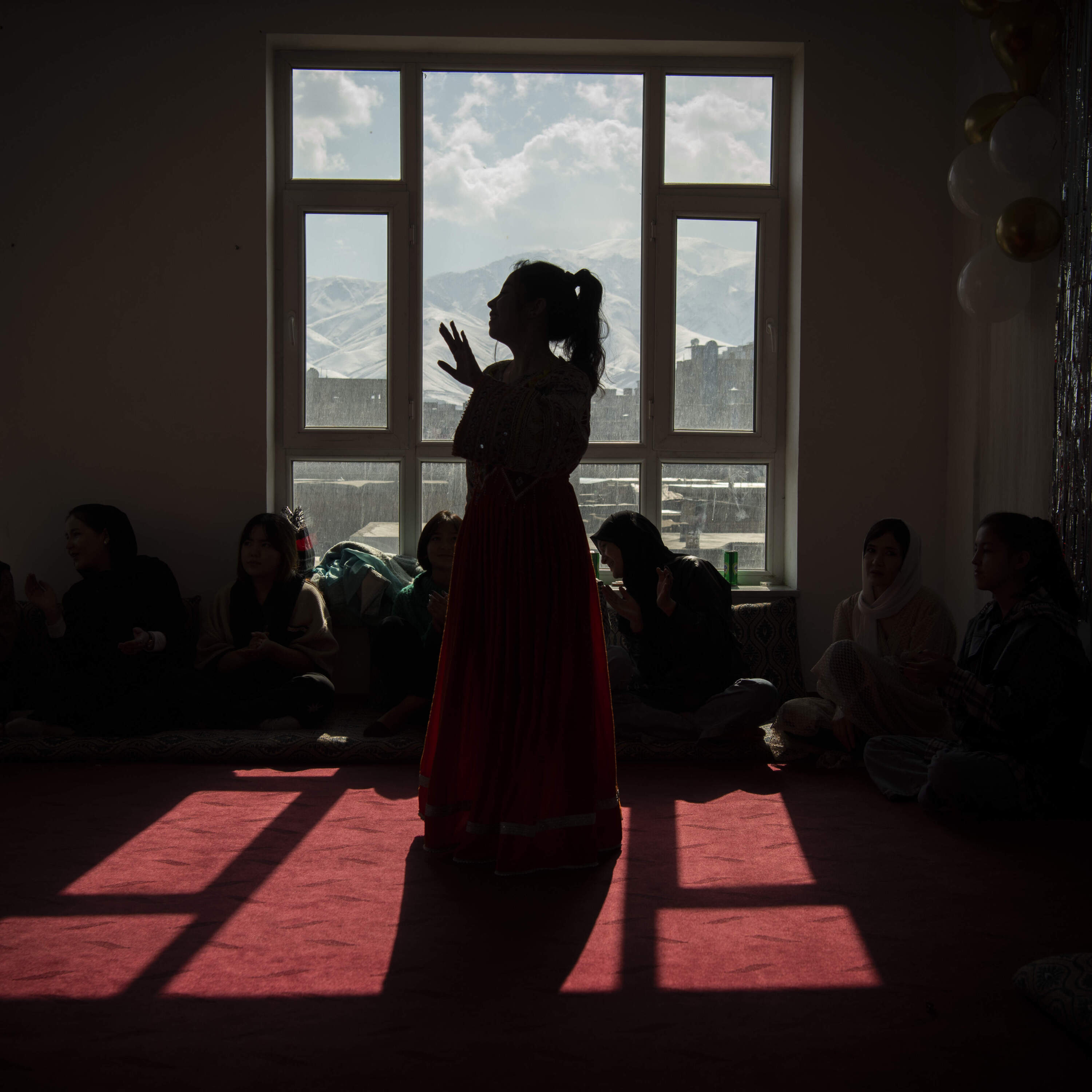 Kabul, Kabul, Afghanistan, February 23, 2024. A group of teenage girls dance at a birthday party of their friend. Music and dancing have been forbidden by the Taliban but womencontinue to dance and celebrate in the privacy of their homes and behind closed doors. (Kiana Hayeri/Fondation Carmignac)