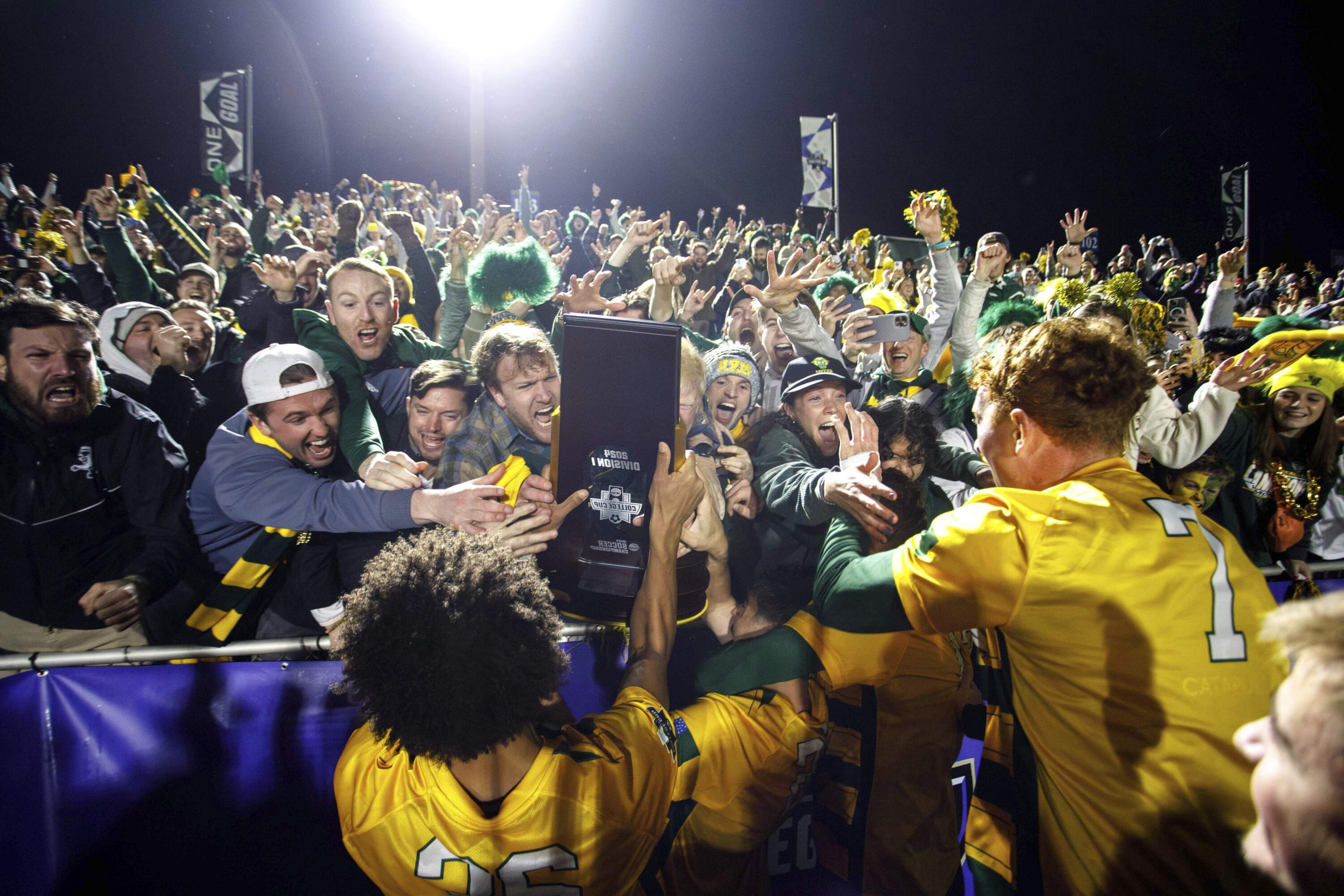 Vermont players celebrate with fans after defeating Marshall in the NCAA College Cup National Championship. (Ben McKeown/AP)