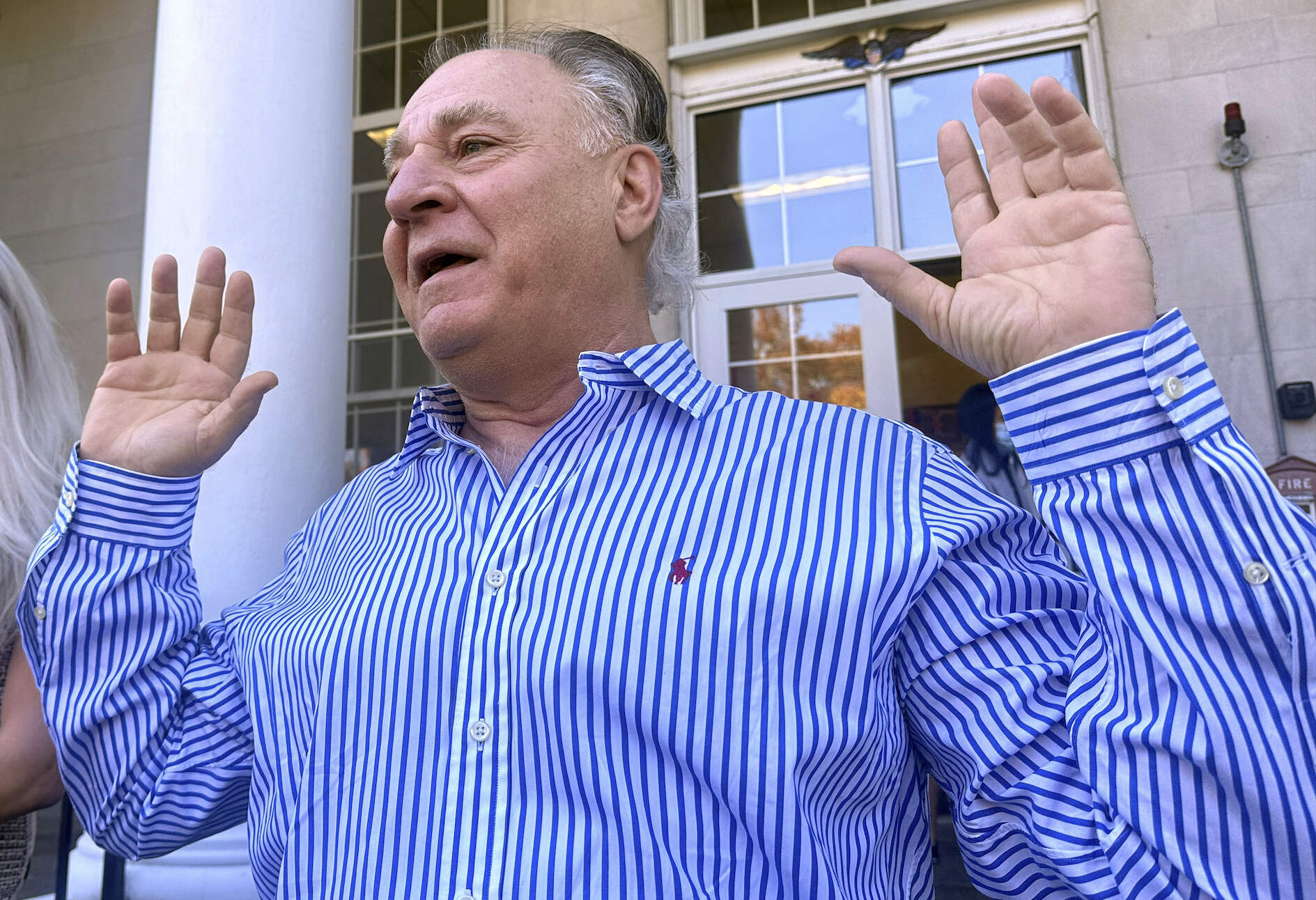 Richard Schiffer Jr. greets supporters on the steps outside Stoughton District Court, Oct. 23, 2024 in Stoughton, Mass. (Michael Casey/AP)