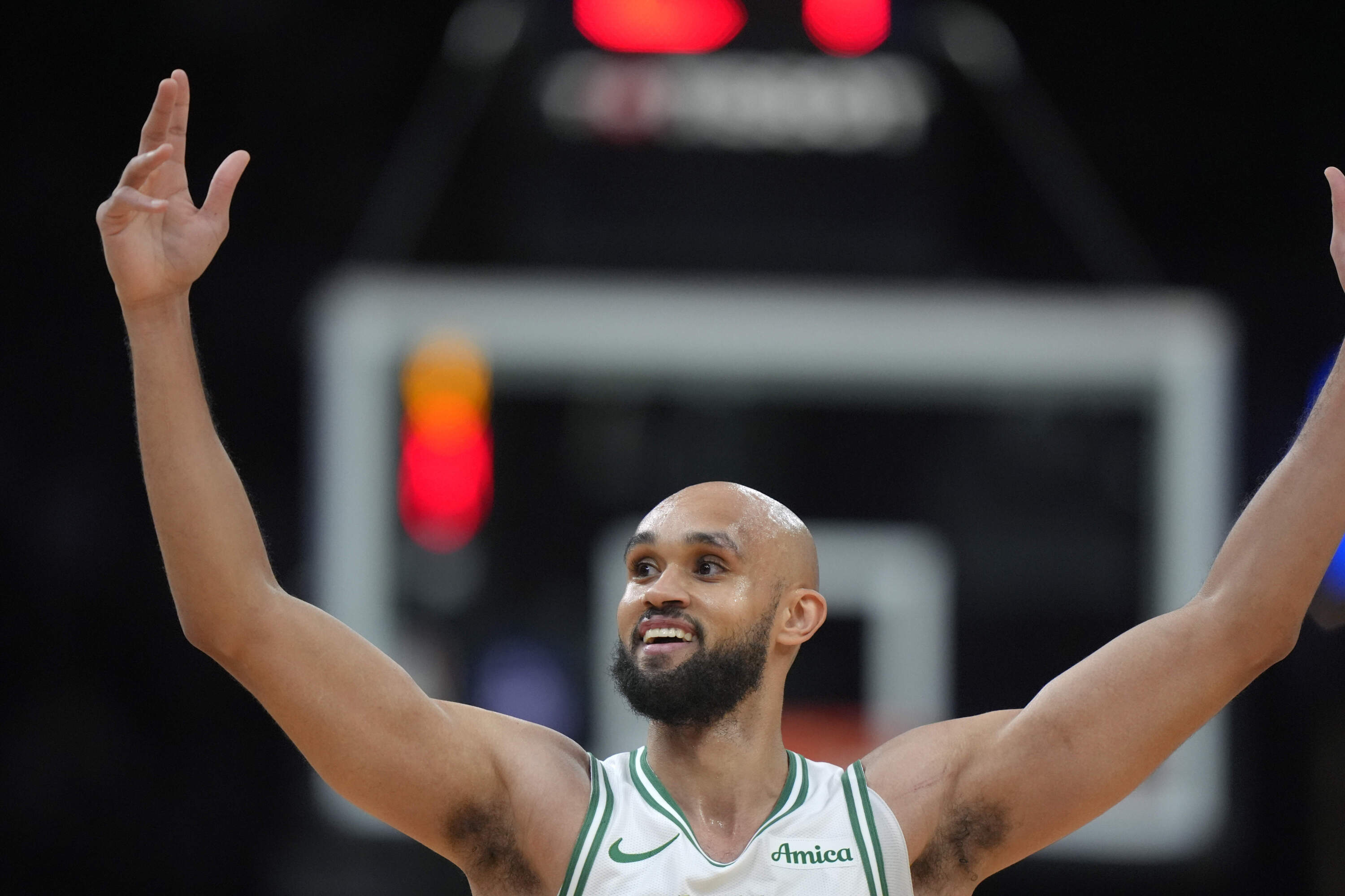 Boston Celtics guard Derrick White celebrates after his team scored a 3-point basket in the first half of an NBA basketball game against the Minnesota Timberwolves, Sunday, Nov. 24, 2024, in Boston. (Steven Senne/AP)