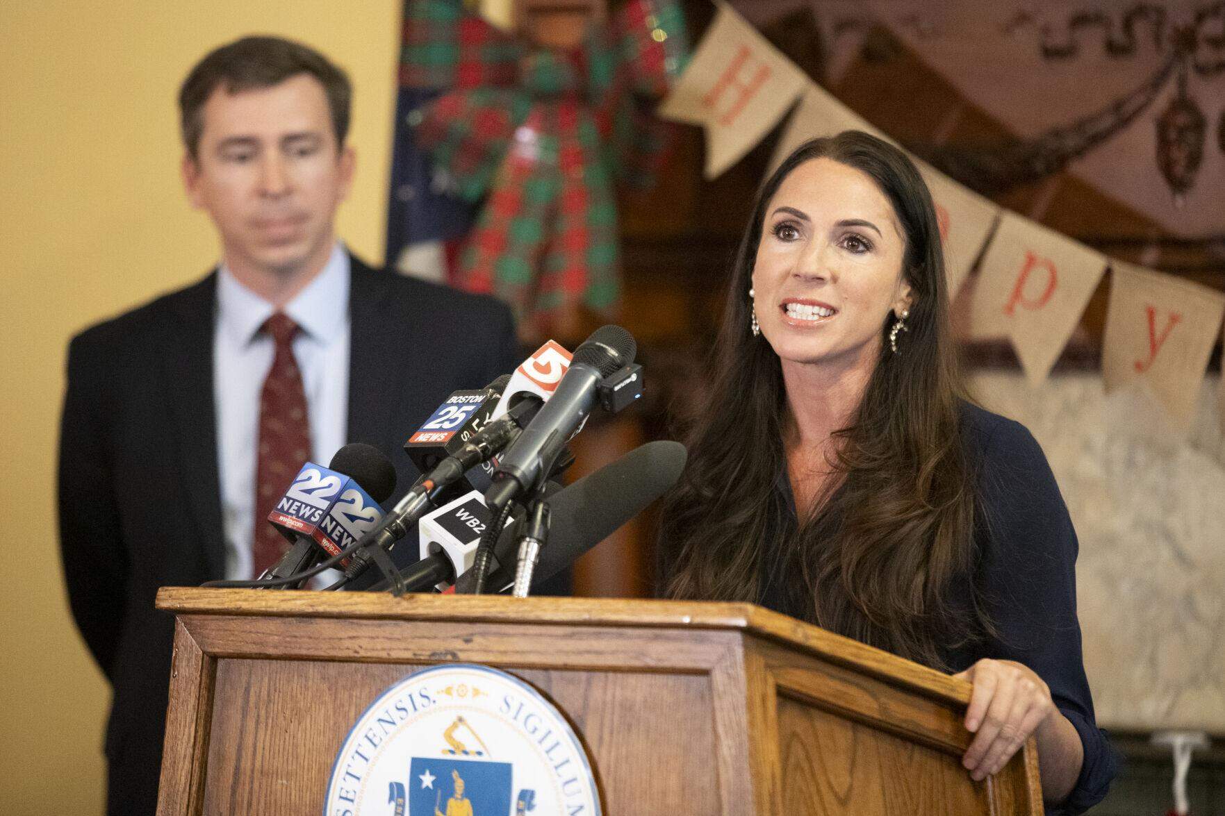 Auditor Diana DiZoglio (right) speaks to reporters in her office on Dec. 4, 2024 while Massachusetts Fiscal Alliance spokesperson Paul Craney (left) watches. (Alison Kuznitz/State House News Service)