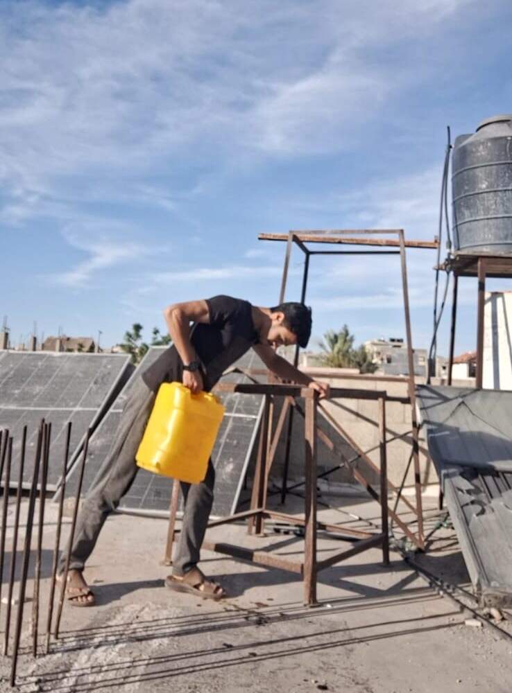 Mohammed Hatem uses propane cans to exercise. (Courtesy of Mohammed Hatem)