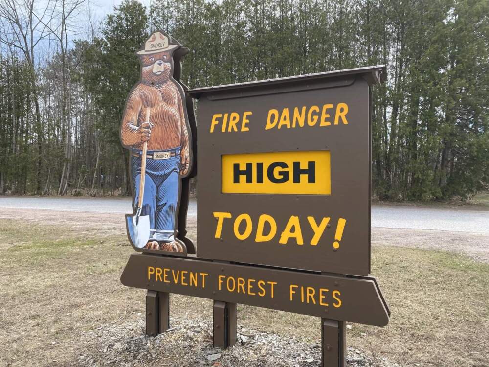 A sign warns of high risk of forest fires in Essex Junction on April 12, 2023. (April McCullum/Vermont Public)