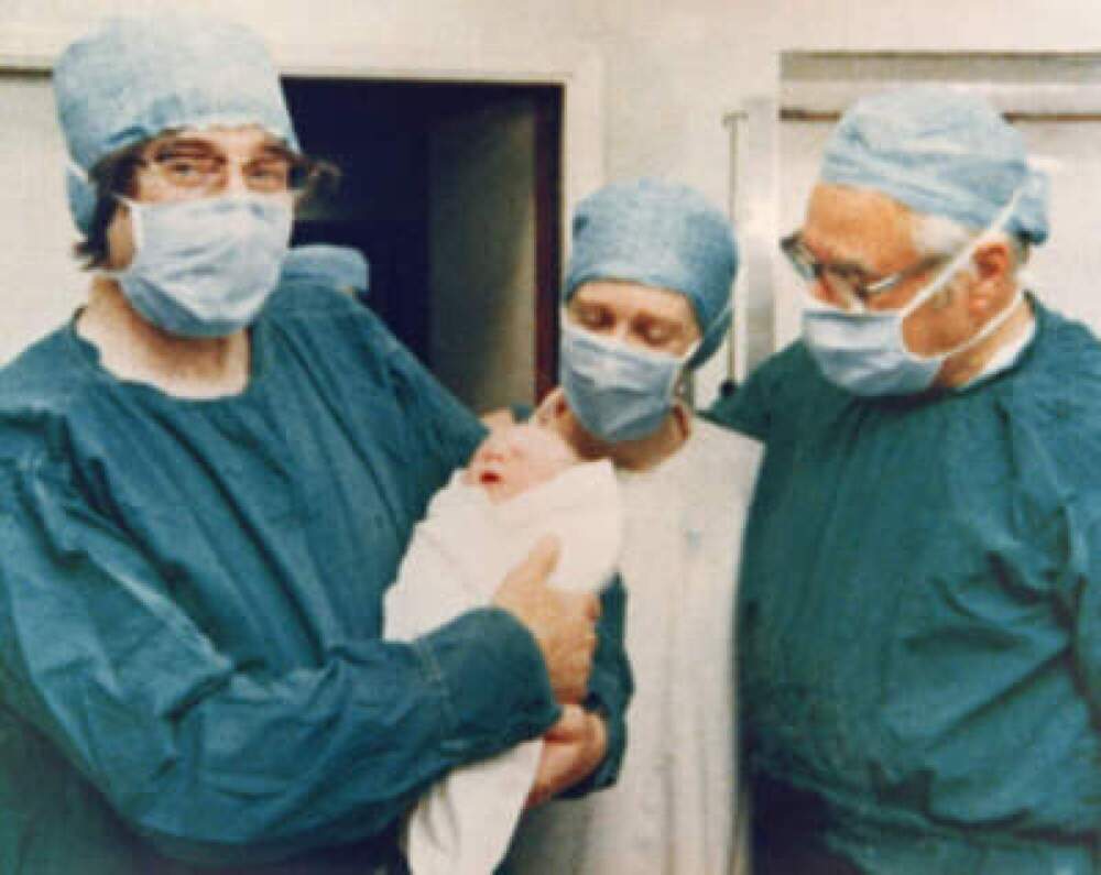 Part of the team who pioneered in vitro fertilization — Robert Edwards (left) and Patrick Steptoe (right) — with the world's first "test tube baby" Louise Joy Brown on July 25, 1978. (Keystone/Getty Images)
