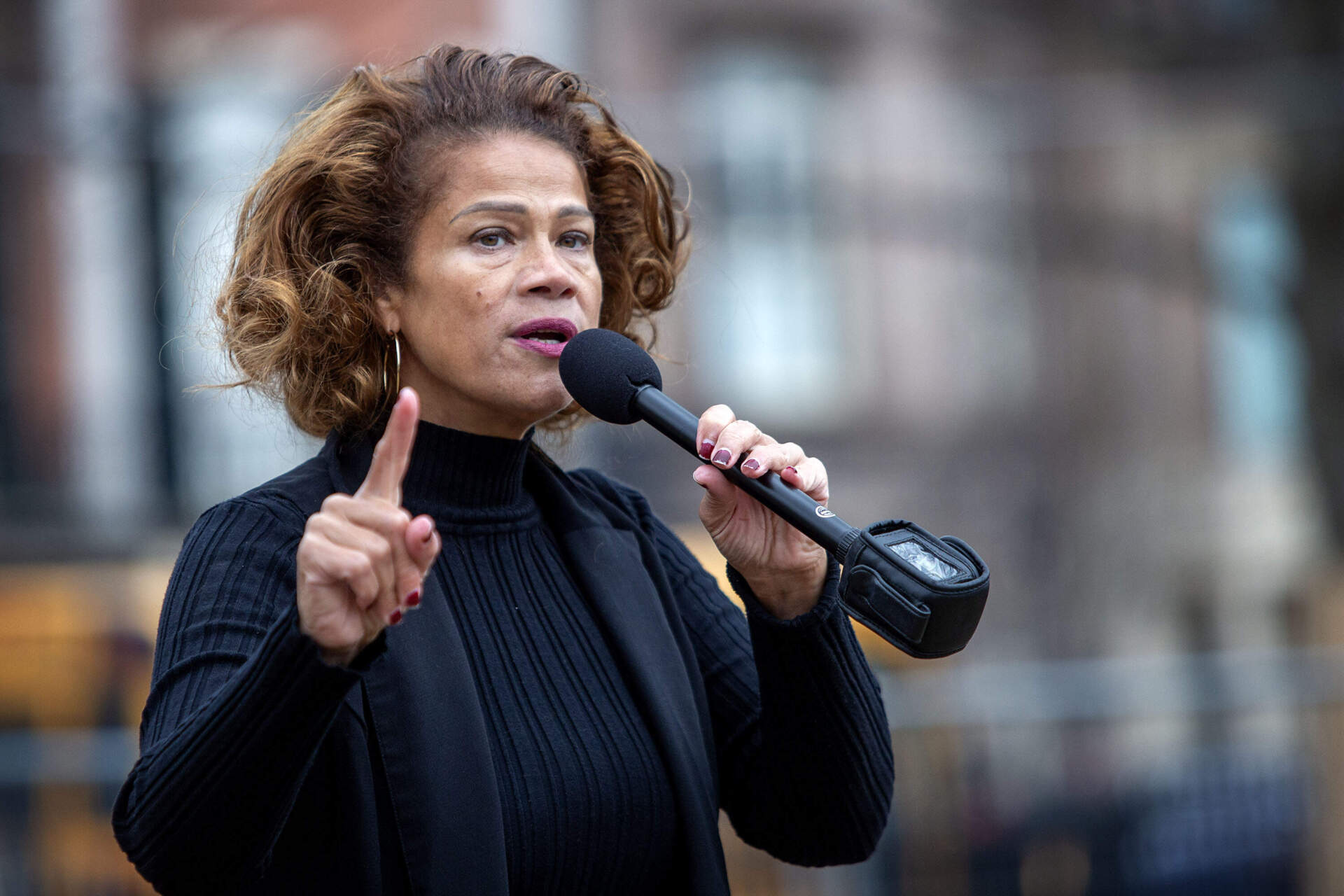 Boston City Councilor At-Large Julia Mejia speaks to protesters taking part in the People's March. (Robin Lubbock/WBUR)