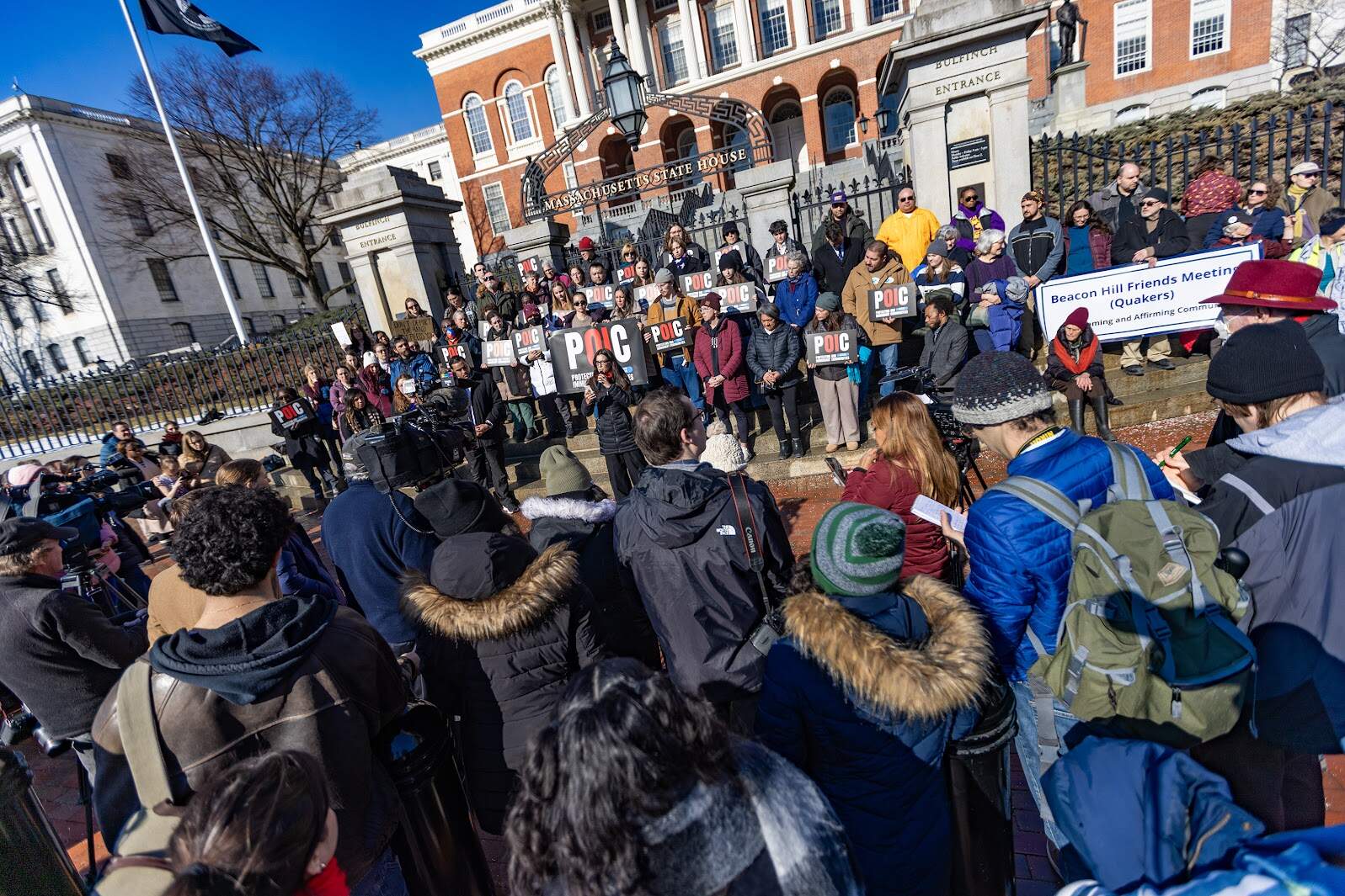 About 100 people gather outside the State House for the Massachusetts Immigrant and Refugee Advocacy Coalition rally launching the “Protect Our Immigrant Communities” campaign. (Jesse Costa/WBUR)