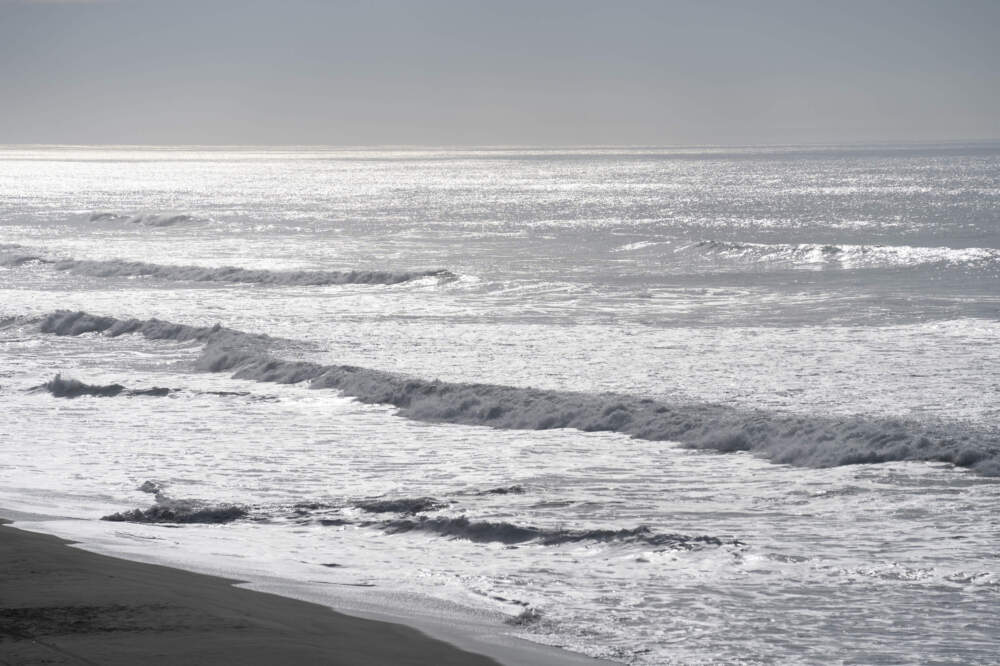 Waves crash onto Ocean Beach in San Francisco during a tsunami warning. (Emily Steinberger/AP)