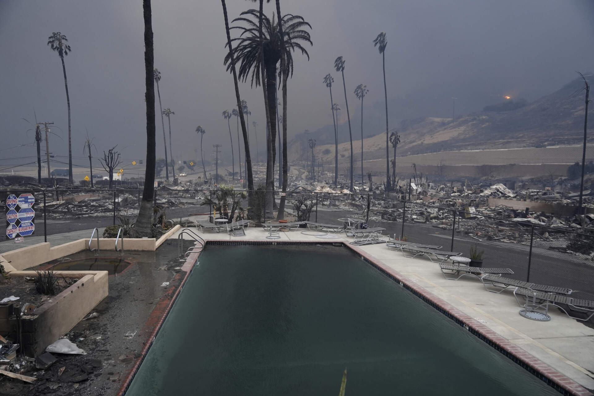 A wildfire-ravaged property is shown after the Palisades Fire swept through in the Pacific Palisades neighborhood on Wednesday. (Damian Dovarganes/AP)
