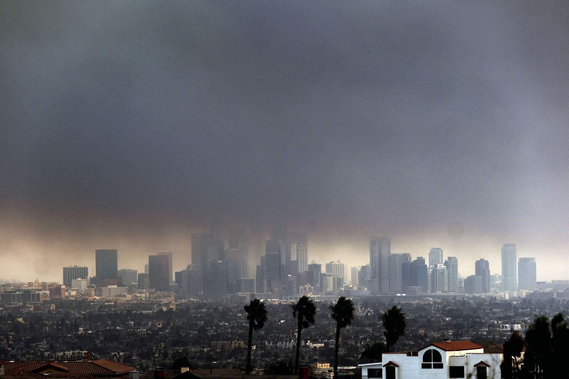 Thick heavy smoke from wildfires shrouds downtown Los Angeles on Wednesday, Jan. 8, 2025. (Richard Vogel/AP)