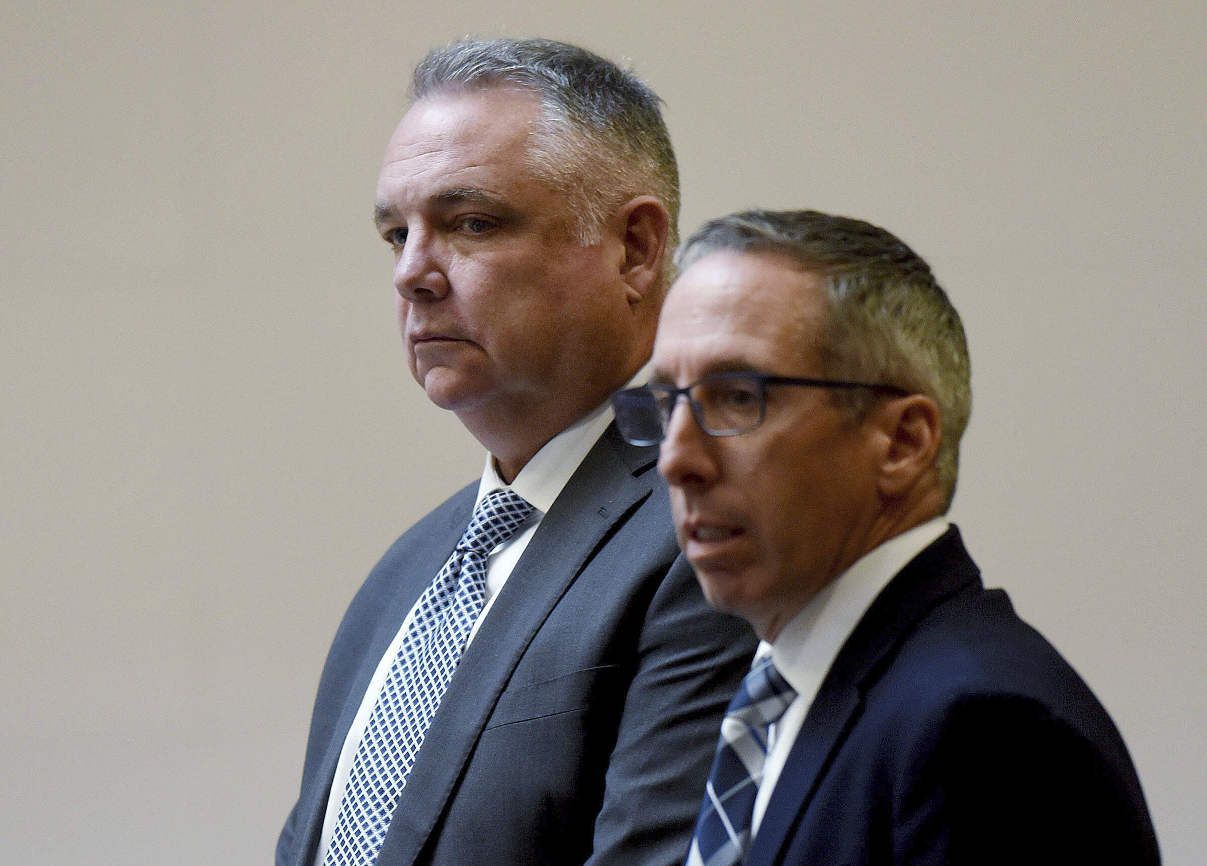 Stephen Murphy, left, stands with his defense attorney Charles Keefe as the jury enters the courtroom for the first day of Murphy's trial at Hillsborough County Superior Court in Manchester, N.H., on Wednesday, Jan. 15. (David Lane/Union Leader, pool via AP)