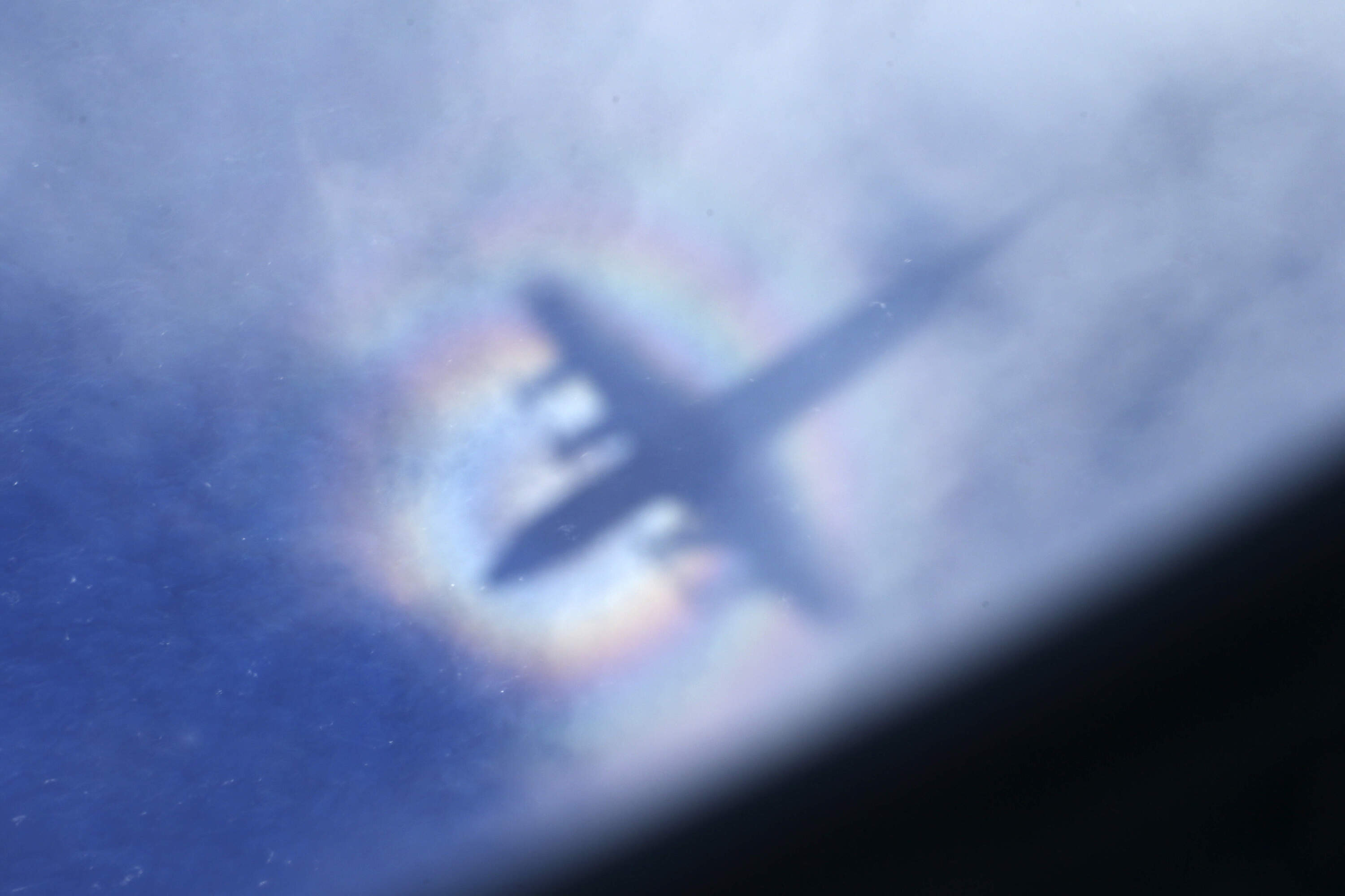 The shadow of a Royal New Zealand Air Force P3 Orion is seen on low level cloud while the aircraft searches for missing Malaysia Airlines Flight MH370 in the southern Indian Ocean, near the coast of Western Australia. (Rob Griffith/AP)