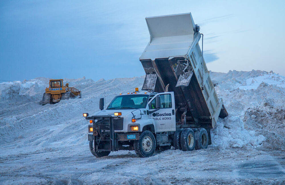 Heavy equipment moving piles of snow in a snow farm in the South Boston on February 11, 2015. The snow piles are reaching over 60 feet. (Rick Friedman/Corbis via Getty Images)