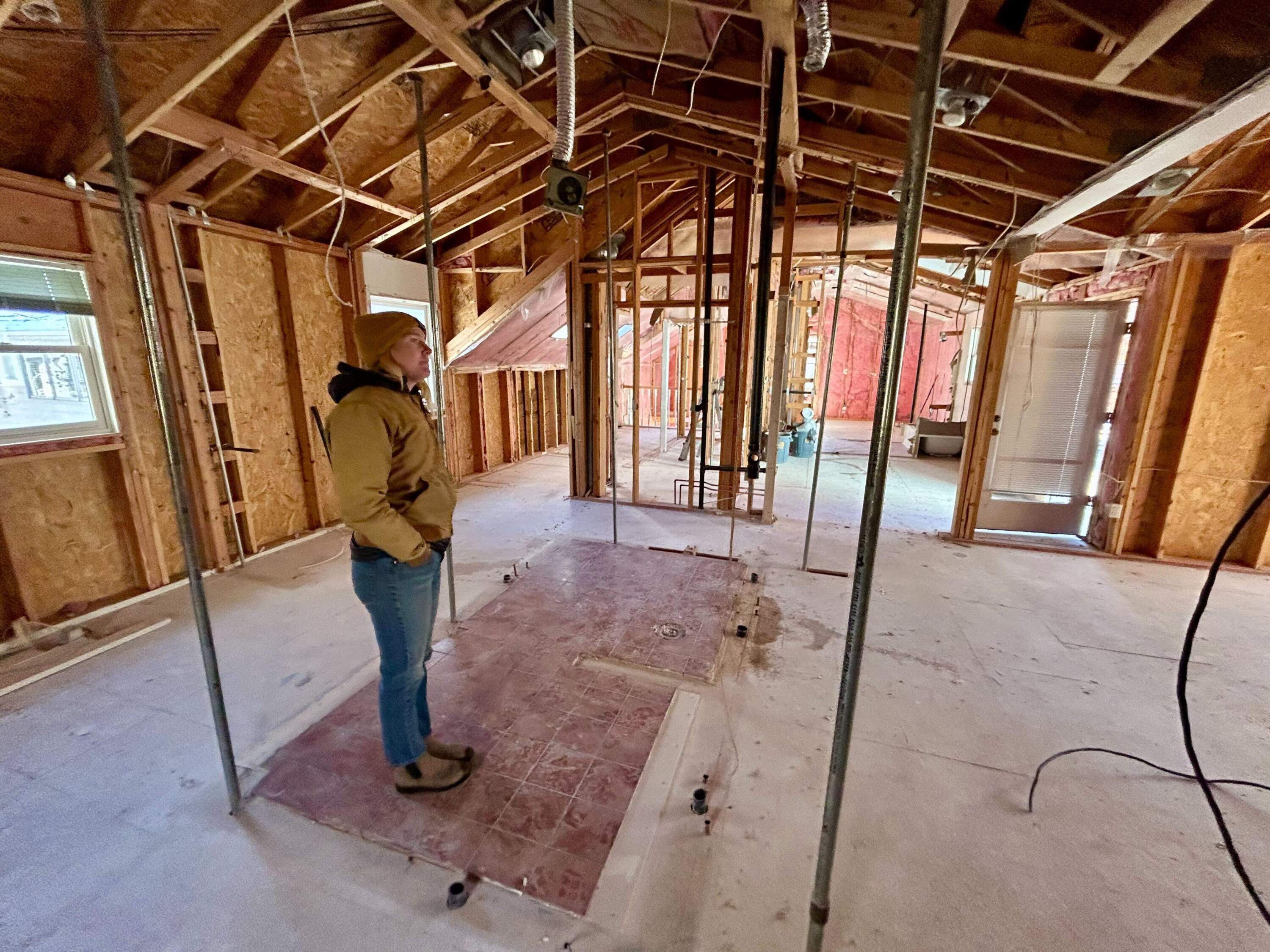 Anna Perks inspects the deconstruction of a two-story home in downtown Boulder, Colorado. (Peter O'Dowd/Here & Now)