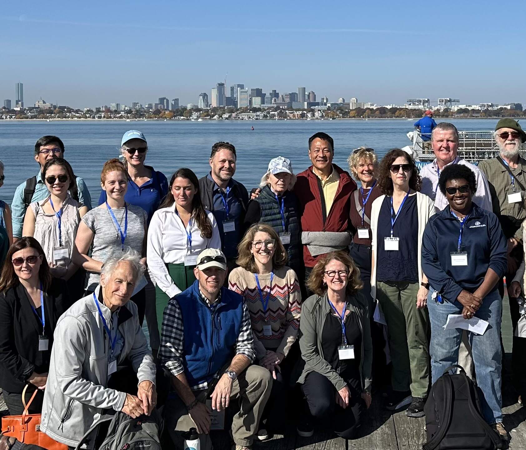 Kongjian Yu and Cathy Stone of the Stone Living Lab (back row center) and part of a group of Climate Professionals on Boston’s Cathleen Stone Island. (Robin Young/Here &amp; Now)