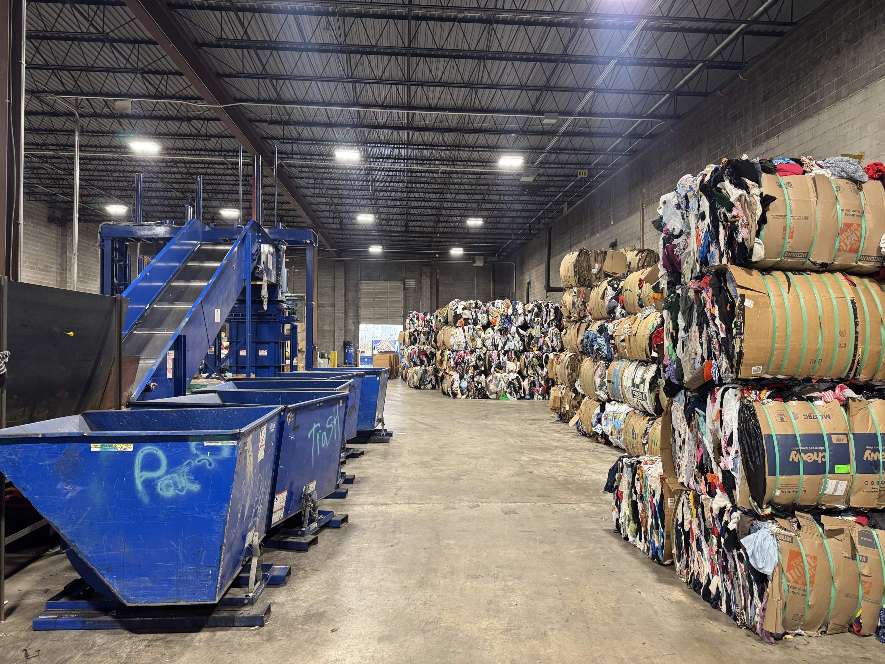 Bales of clothing at Whitehouse & Schapiro are ready to be shipped around the world for resale. (Chris Bentley/Here & Now)