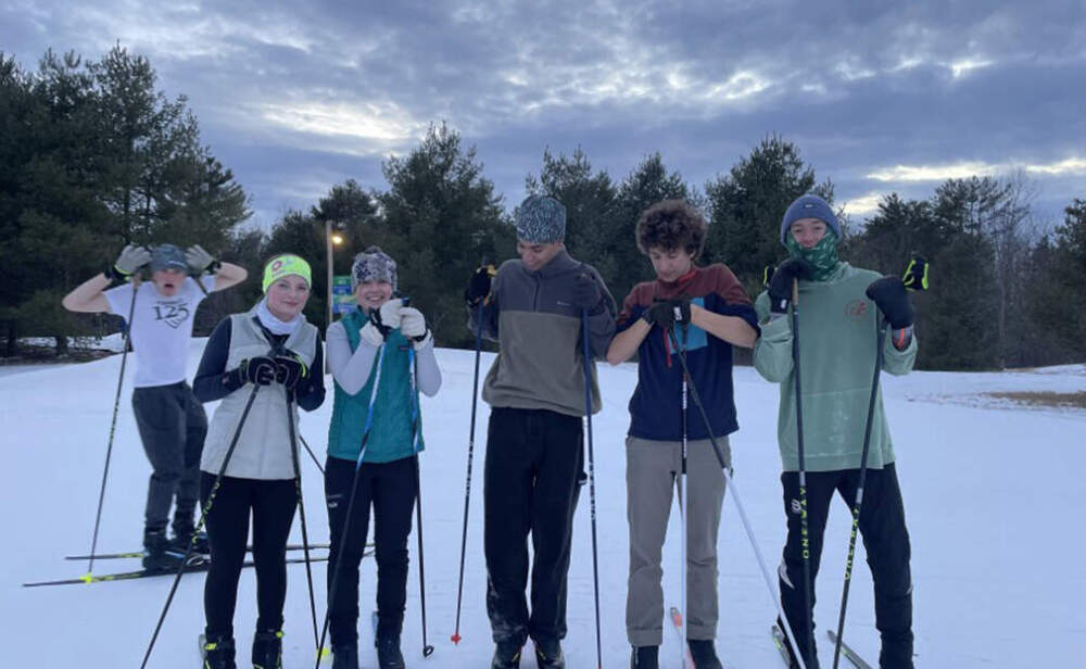 Waynflete high school teammates practice at Quarry Road Trails in Waterville. From left to right: Athena Esbjörn-Hargens, Audrey Winch, Omari Bernt, Amos Not to and Charles Reynolds. (Molly Enking/Maine Public)