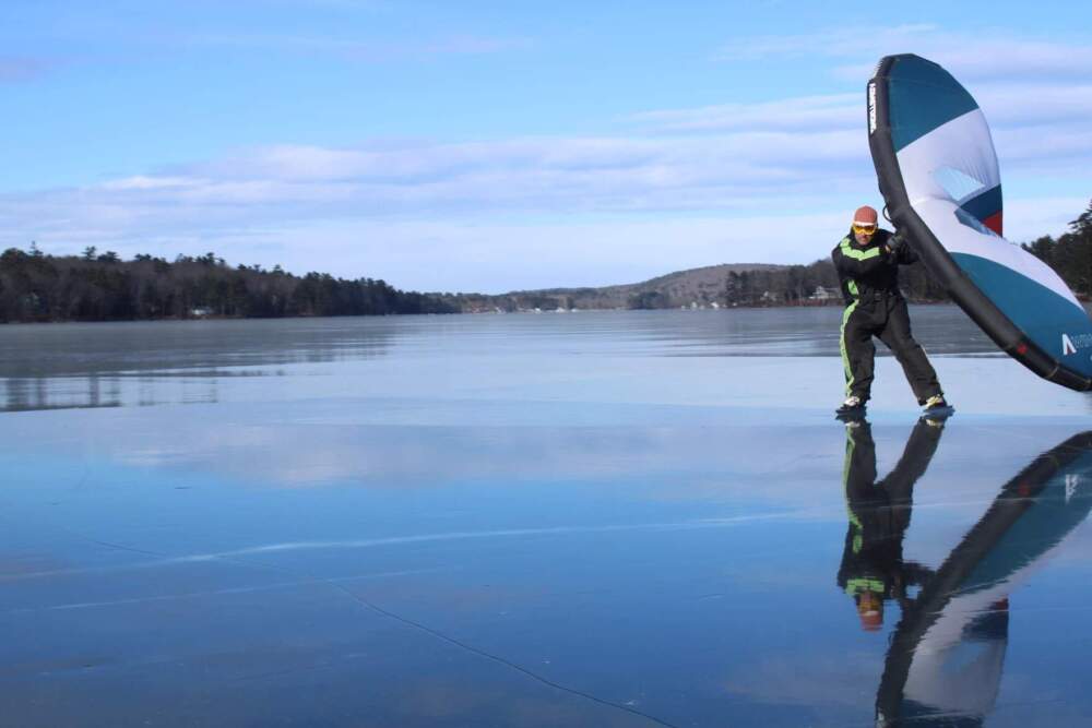 Karl Ramsdell, of Old Orchard Beach, skate sailing on Highland Lake on Wednesday, Jan. 8. (Ari Snider/Maine Public)