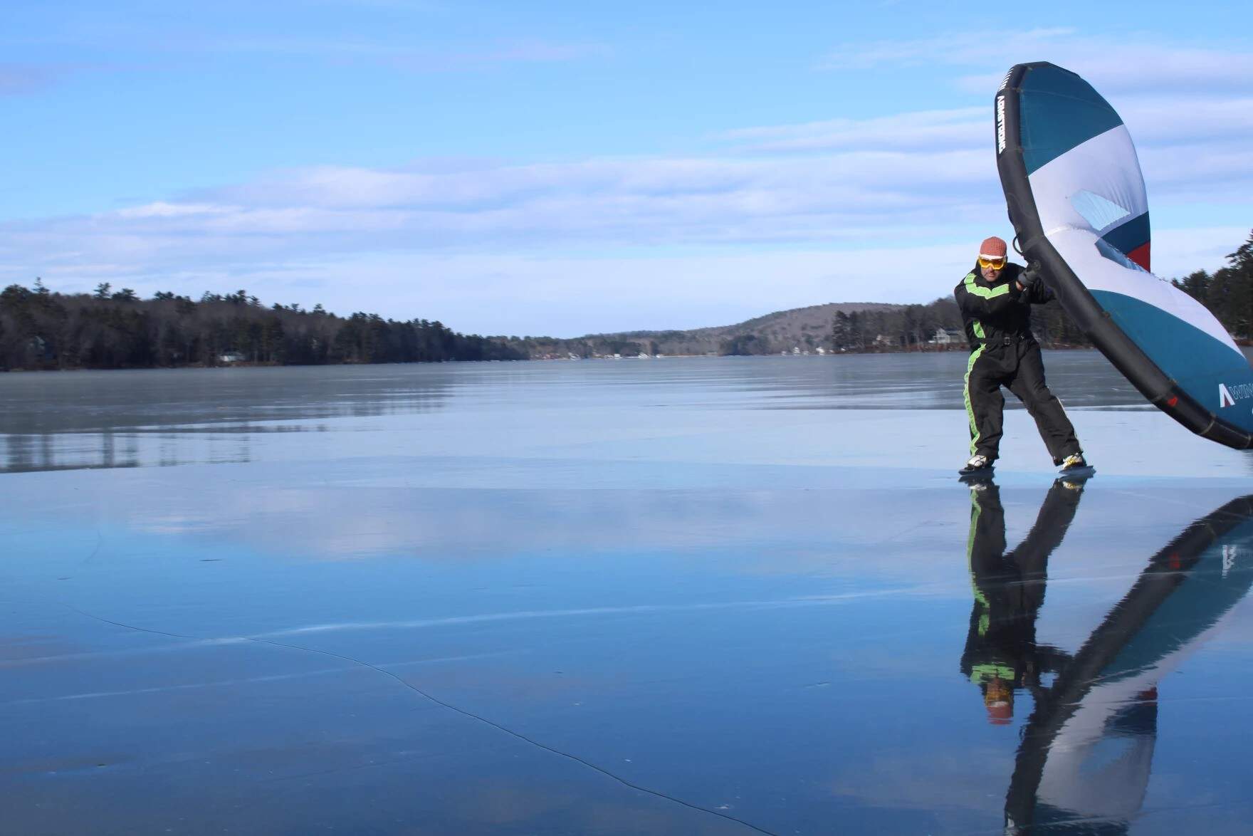 Karl Ramsdell, of Old Orchard Beach, skate sailing on Highland Lake on Wednesday, Jan. 8. (Ari Snider/Maine Public)