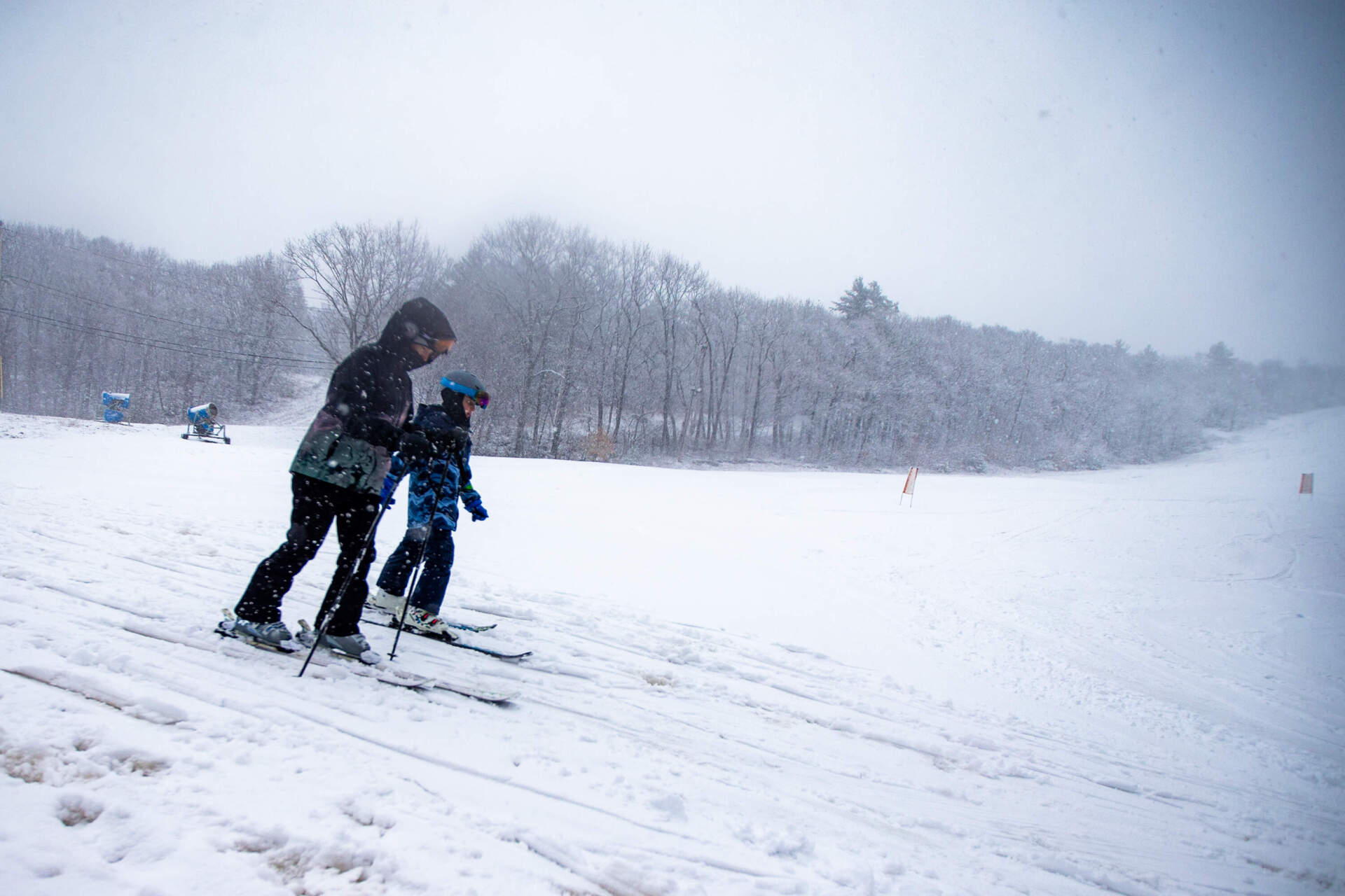 Skiers at the Blue Hills Ski Area in Canton during a nor'easter in 2024. (Jesse Costa/WBUR)