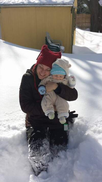 Janine Liberty playing in the show with her infant after the snowstorms of 2015.