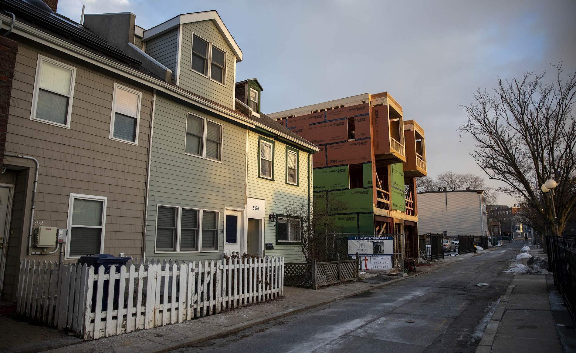 Two luxury townhouses under construction on Athens Street in South Boston in 2022. (Robin Lubbock/WBUR)