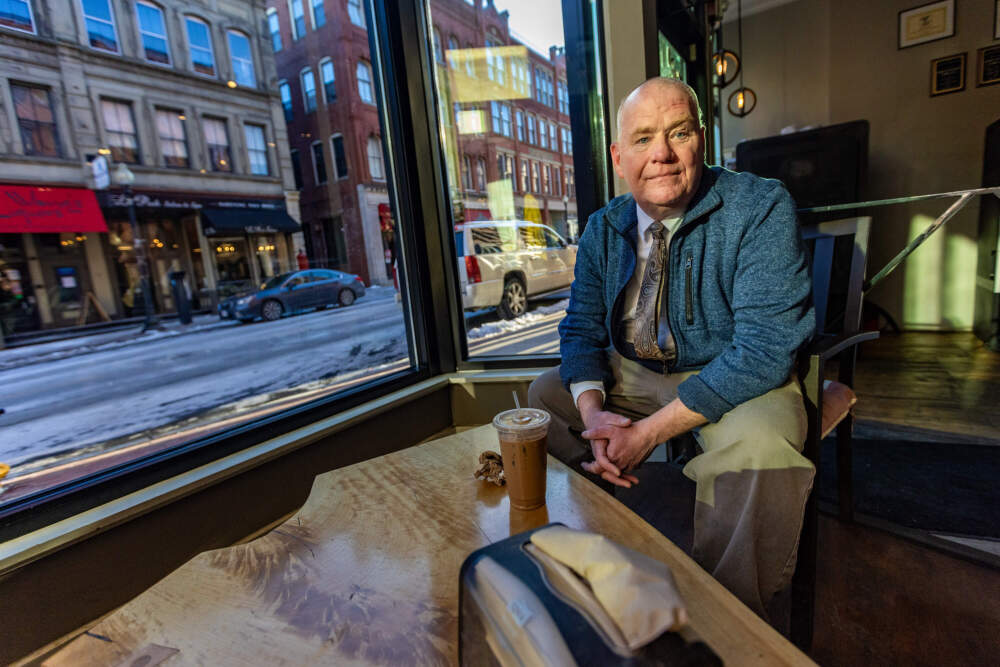 Robert Hanson spending time after his part-time shift at Battle Grounds Coffee Company in downtown Haverhill. (Jesse Costa/WBUR)