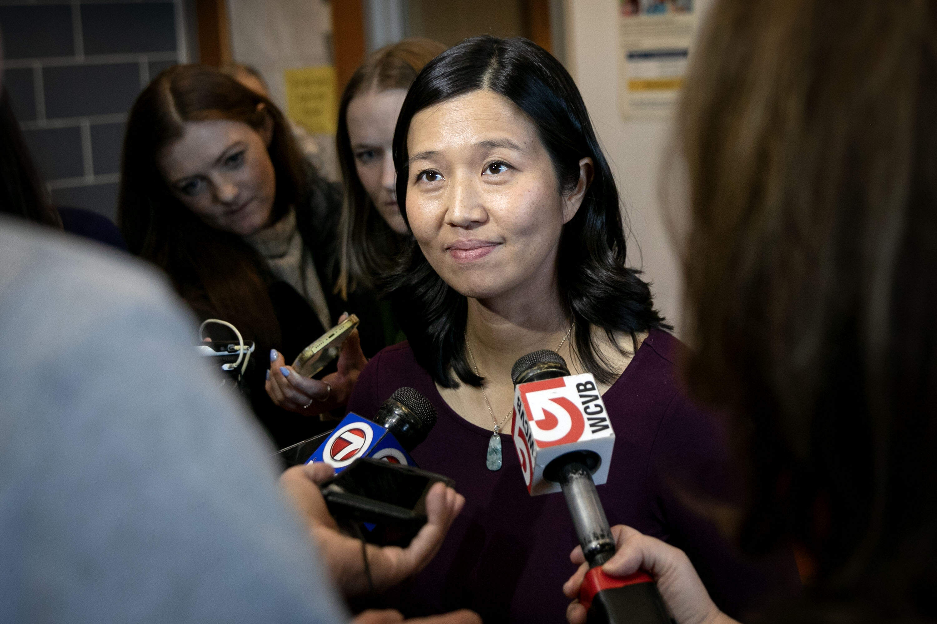 Mayor Michelle Wu takes question from reporters during a visit to the Grove Hall Community Center in Dorchester, Mass. (Robin Lubbock/WBUR)